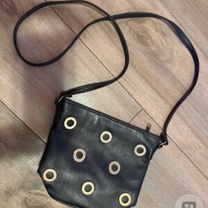 Stylish Black Crossbody Bag with Gold Accents
